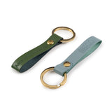 A set of leather keyrings embossed with  Anne Hathaway's Cottage, both attached to gold metallic rings