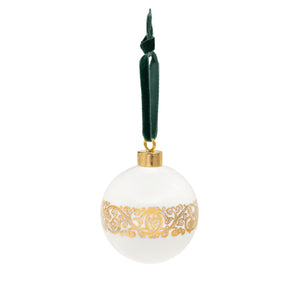 White ceramic bauble decoration with golden patterns from the First Folio and Shakespeare's initials, hung from a bluish green velvet ribbon.