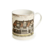 Souvenir white china mug featuring an old coloured drawing of Shakespeare's Birthplace, with a dog in the foreground. Under the drawing the handwritten text says 'The House in Stratford upon Avon, in which Shakespeare was born'.