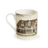 Souvenir white china mug featuring an old coloured drawing of Shakespeare's Birthplace, with a dog in the foreground. Under the drawing the handwritten text says 'The House in Stratford upon Avon, in which Shakespeare was born'.